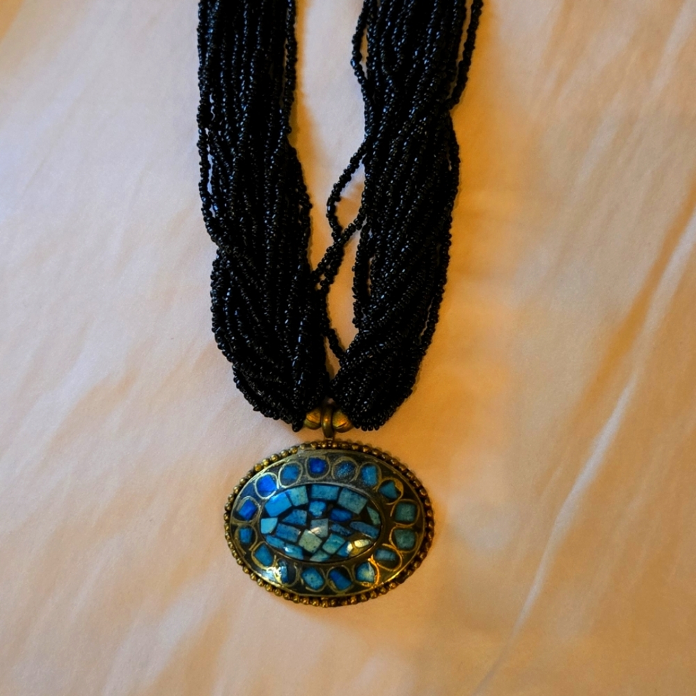 Vintage Black Beaded necklace with Brass pendant w/ Turquoise inlaid into the pe
